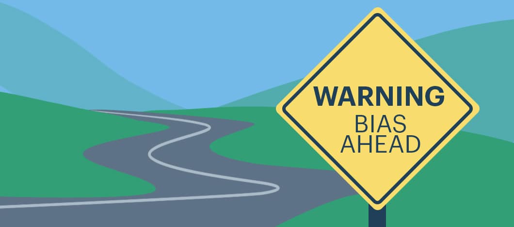 A diamond-shaped road sign reads “Warning: Bias Ahead.”