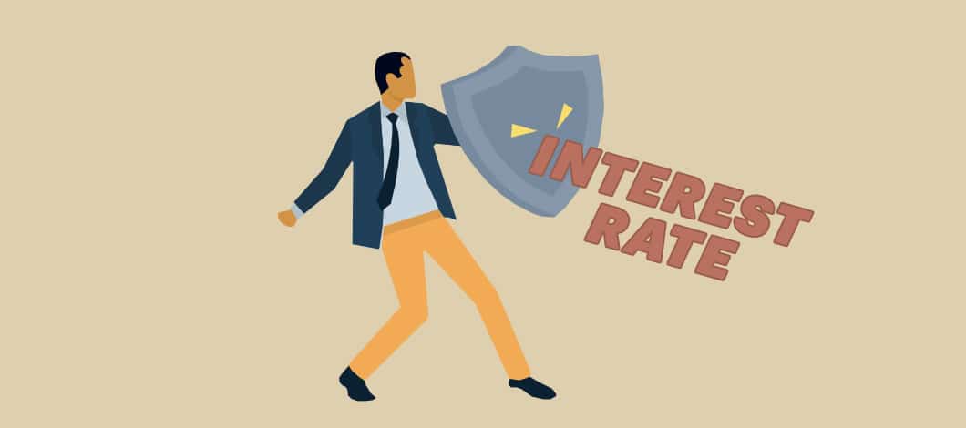 A person wielding a shield deflects the words “Interest Rate.”