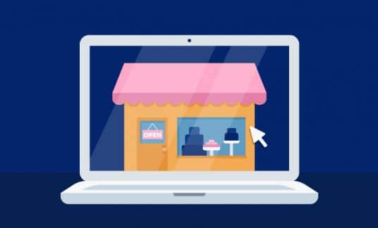 The screen of a laptop computer displays an image of a small shop.