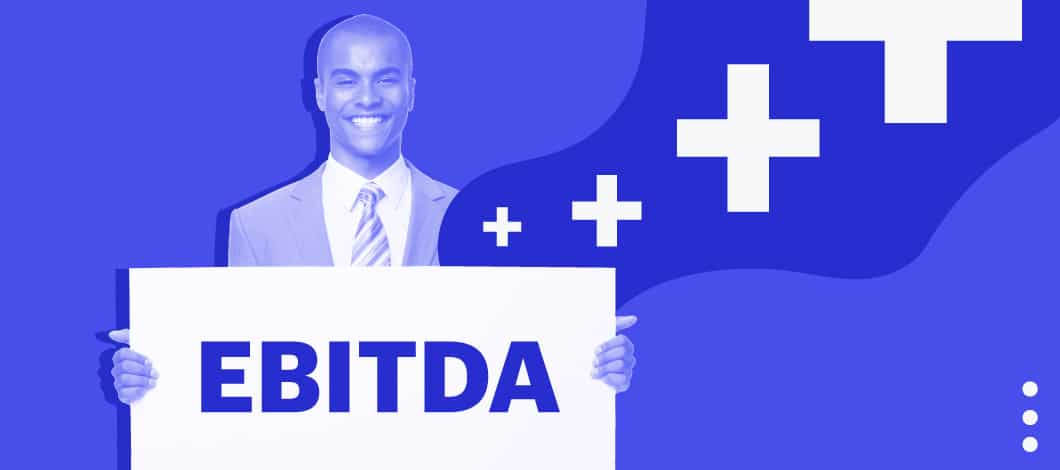 A man holds up a sign with the letters “EBITDA.”