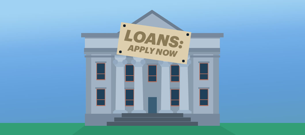A bank has a sign that reads, “Loans: Apply Now.”