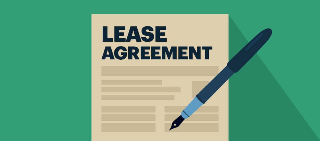 An ink pen rests on a document labeled “Lease Agreement.”