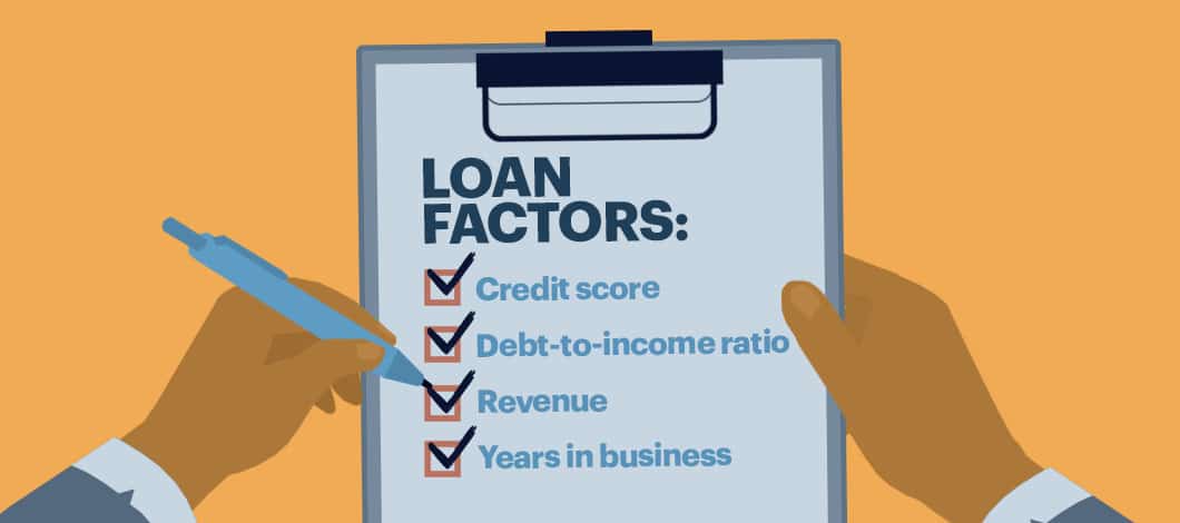 One hand holds a clipboard with a notepad featuring a checklist labeled “Loan Factors.” The other hand holds a pen and has checked off the following on the list: “Credit score”; “Debt-to-income ratio”; “Revenue”; and “Years in business.”