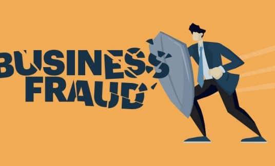 A man wielding a shield bashes and shatters the words “Business Fraud.”