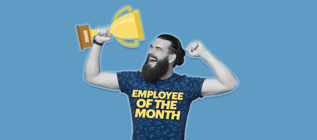 A happy worker wearing an “Employee of the Month” shirt hoists up a trophy.