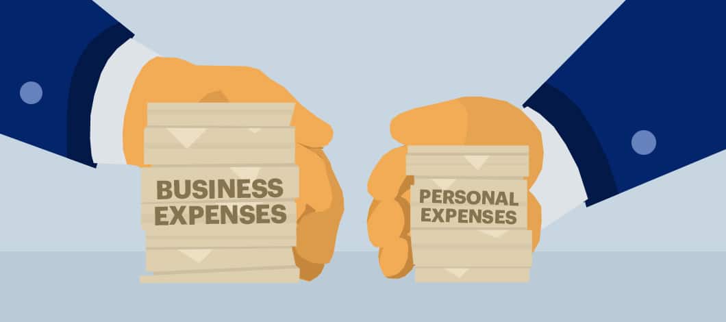 A pair of hands separate two stacks of paper, one labeled “Business Expenses” and the other marked “Personal Expenses.”