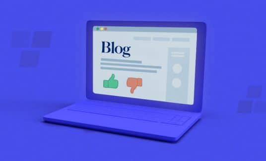 On a computer screen, a website labeled “Blog” features a thumbs-up emoji and a thumbs-down emoji.