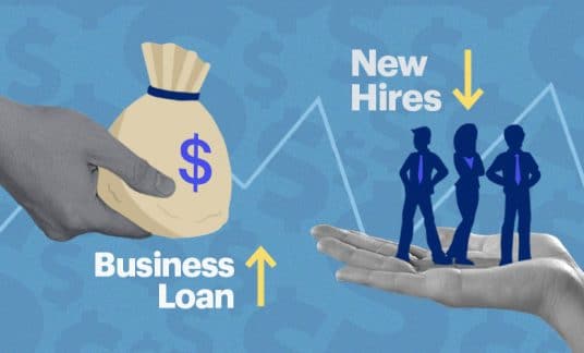 One hand extends a sack of cash marked “Business Loan” to another, open-palmed hand. Three small people tagged as “New Hires” stand on the palm.