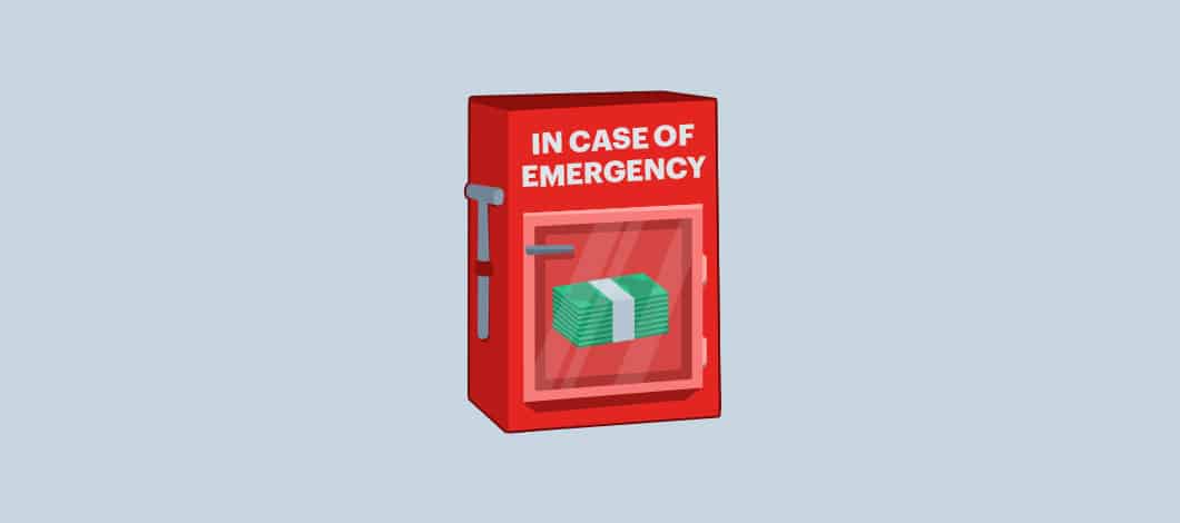 Stacks of cash sit inside a box with a glass front that reads “In Case of Emergency” with a small hammed dangling from a chain on the side.